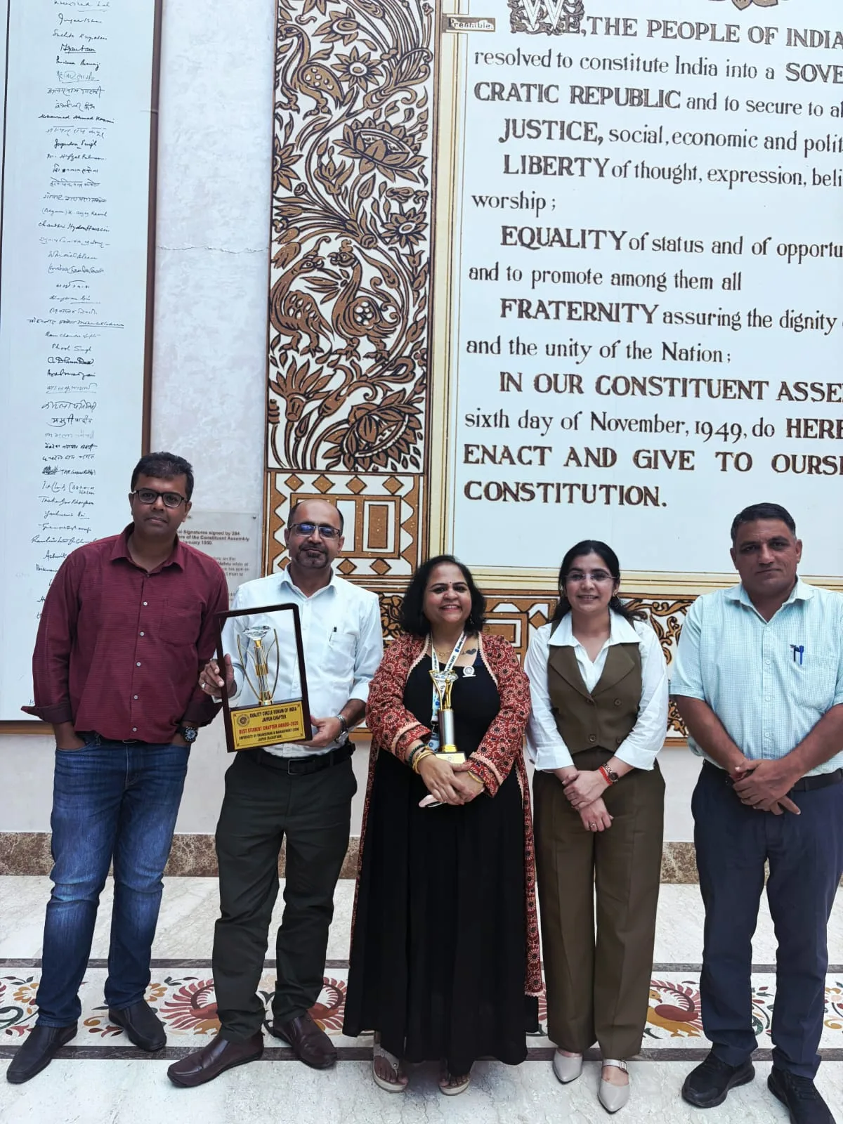 Prof. Dr. Preeti Sharma receiving QCFI recognition